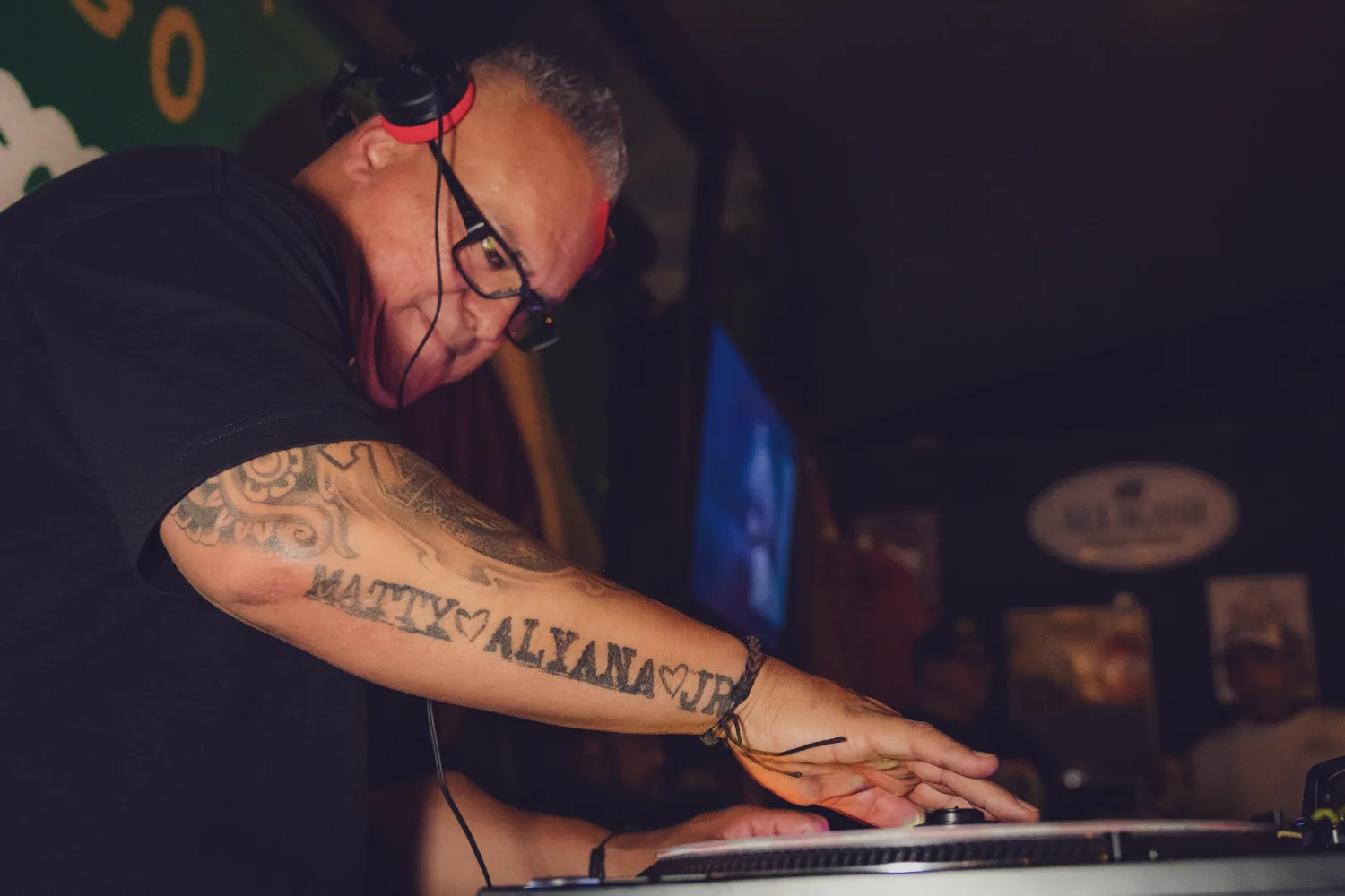Close-up of DJ Big Al working the turntables at Verdugo Bar